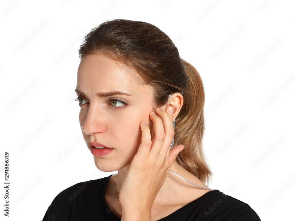 Female security guard using radio earpiece on white background Female security guard using radio earpiece on white background