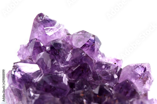 Beautiful purple amethyst gemstone on white background, closeup
