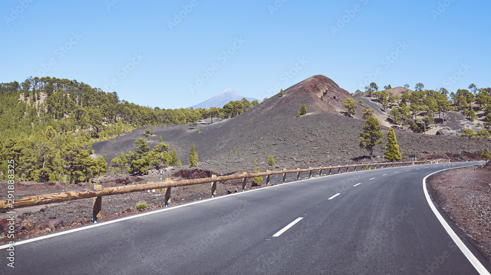 Scenic road with Teide Volcano in distance, color toning applied, Tenerife, Spain.