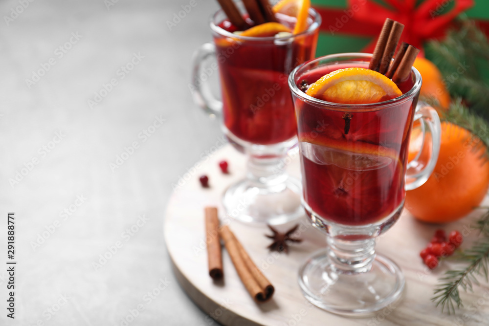 Glass cups with mulled wine on table. Space for text Glass cups with mulled wine on table. Space for text