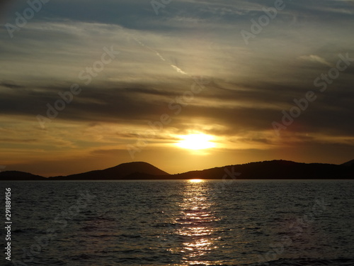 golden hour beautiful colors cloudy sunset horizon above sea at evening igoumenitsa city greece © tassos stavrou