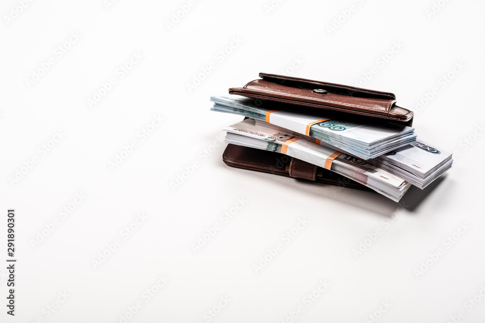 stacks with russian money in leather wallet on white stacks with russian money in leather wallet on white