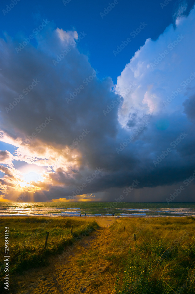 Fast weather change after days rather boring weather. Welcomed by the people. Baltic Sea in summer. People did not even shy away from approaching lightning and thunder. (The photographer fled...)