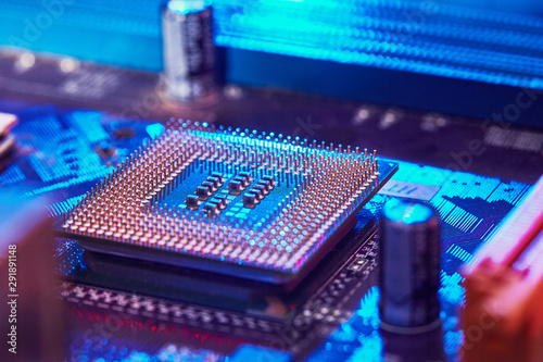 chip is highlighted with blue light. Technology background