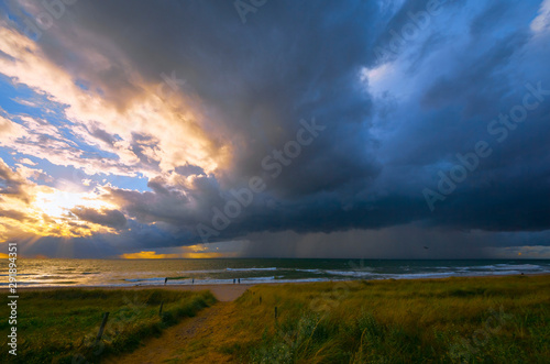 Fast weather change after days rather boring weather. Welcomed by the people. Baltic Sea in summer. People did not even shy away from approaching lightning and thunder. (The photographer fled...)