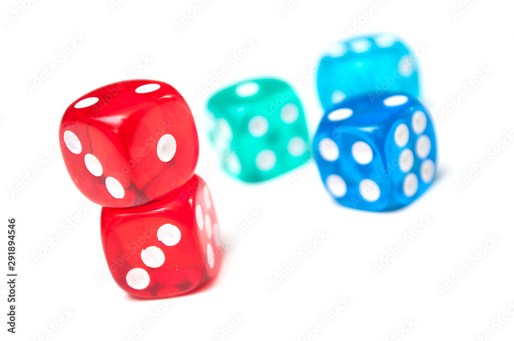 Closeup of colorful dices on white background Closeup of colorful dices on white background
