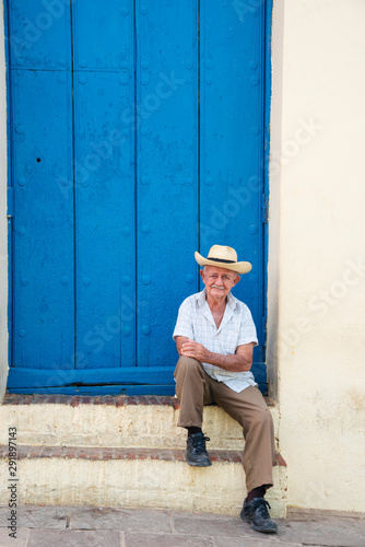 Wallpaper Mural Local man relaxing on the street in Trinidad, Cuba Torontodigital.ca