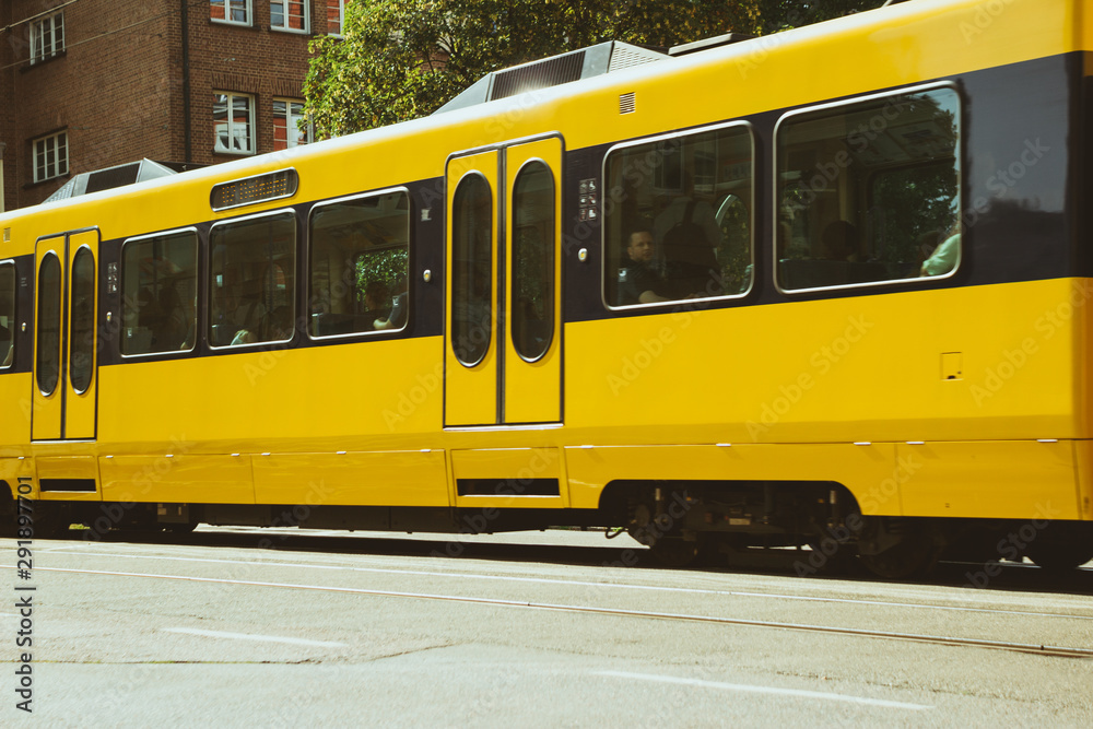 yellow tram, subway in a city