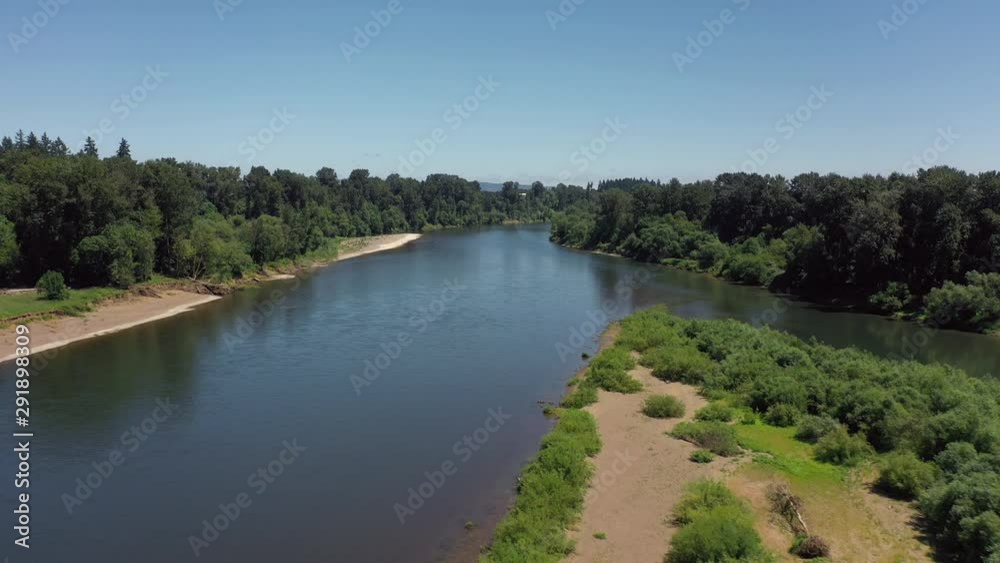 river aerial dolly over water with trees and beaches river aerial dolly over water with trees and beaches