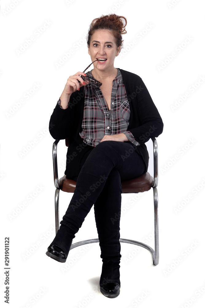 woman sitting on a chair on white background woman sitting on a chair on white background