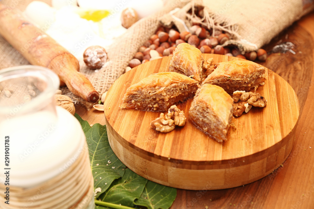 Baklava with ingredients on the wooden table Baklava with ingredients on the wooden table