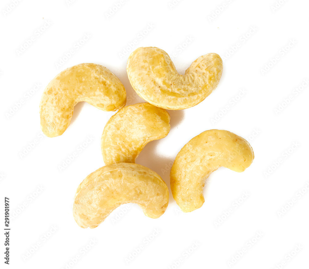 raw cashew in a glass jar isolated on white raw cashew in a glass jar isolated on white
