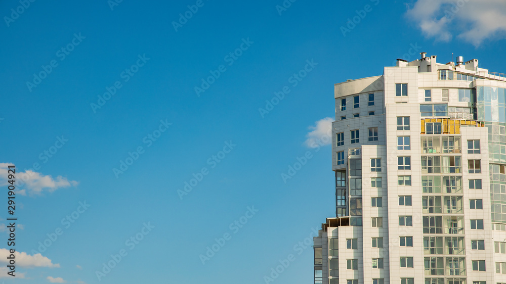 modern clean city urban view white tower building on blue sky background with empty copy space for text modern clean city urban view white tower building on blue sky background with empty copy space for text