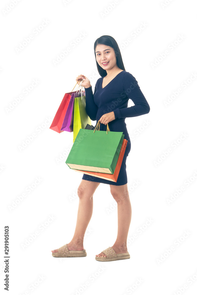 Asian beautiful woman pose show shopping bag on her hands.