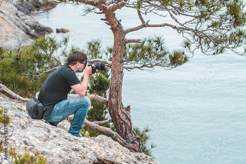 Photographer in the wild nature