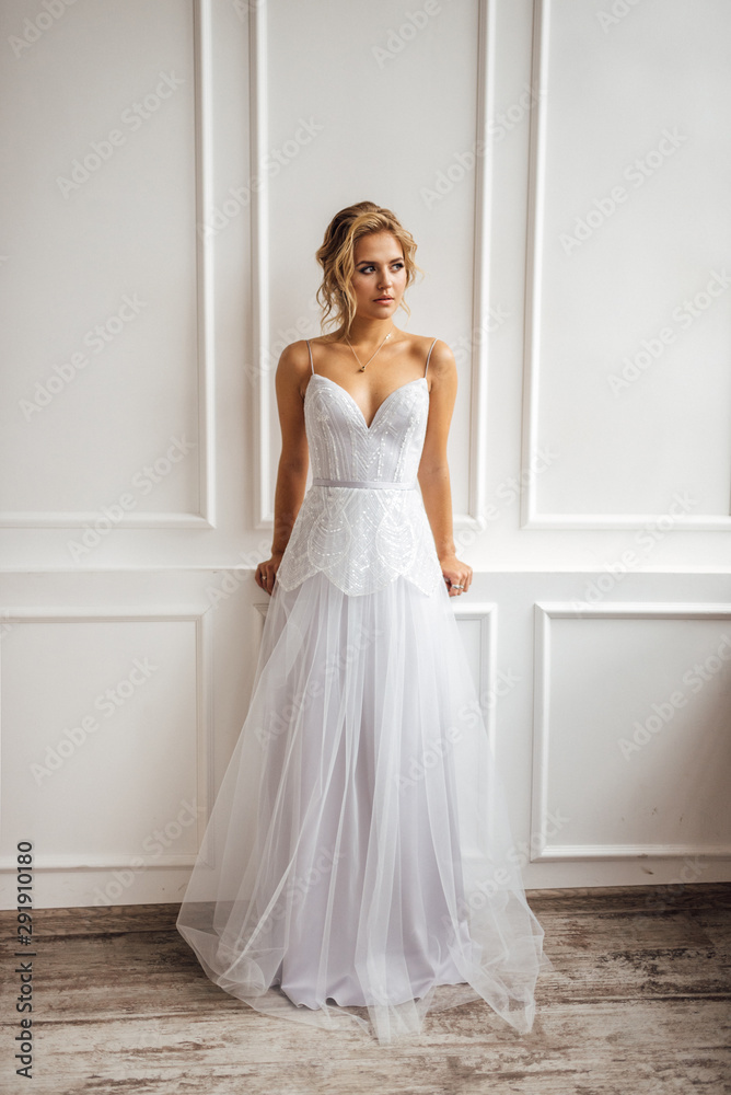 bride in beautiful dress in white Studio bride in beautiful dress in white Studio