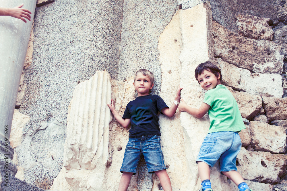 little boy exploring ancient architecture, lifestyle people on summer vacation close up little boy exploring ancient architecture, lifestyle people on summer vacation close up