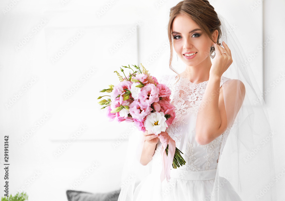 Beautiful young bride with bouquet before wedding ceremony at home Beautiful young bride with bouquet before wedding ceremony at home