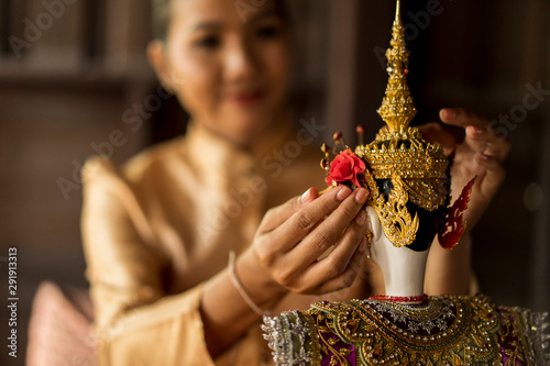 People or Traditional Thai Puppet Theater of Arts and culture concept. Asian woman hand holding The  Sita  Traditional Thai style puppet dolls with elegant costume