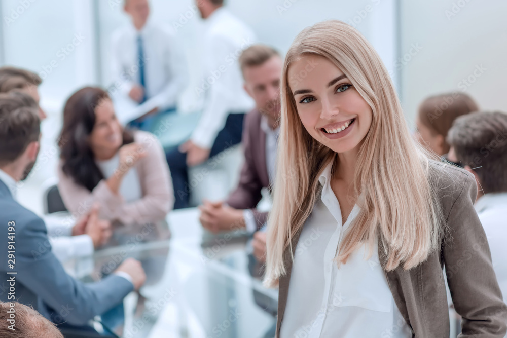 close up. smiling young employee standing in the office close up. smiling young employee standing in the office
