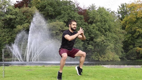 Man training calves in park near fountain