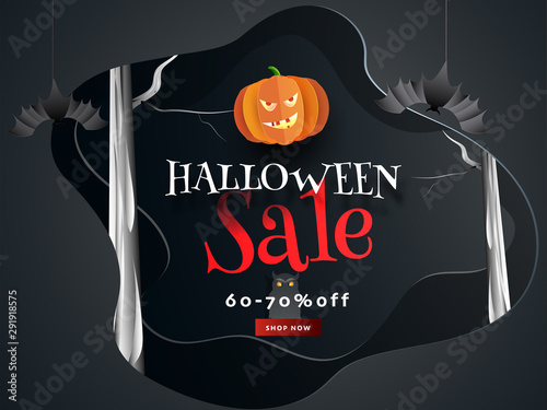 Paper cut banner or poster design decorated with hanging bats, jack-o-lantern and 60-70% discount offer for Halloween Sale. photo