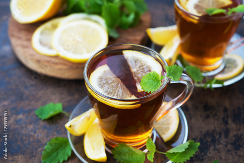 Black hot tea with lemon and mint. Warming autumn revitalizing drink.