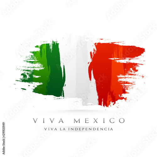 Viva Mexico Happy Independence Day text in spanish language with Mexican flag color brush stroke effect background. Can be used as poster or greeting card design.