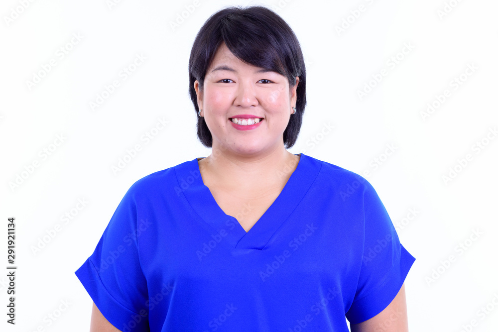 Face of happy overweight Asian businesswoman smiling