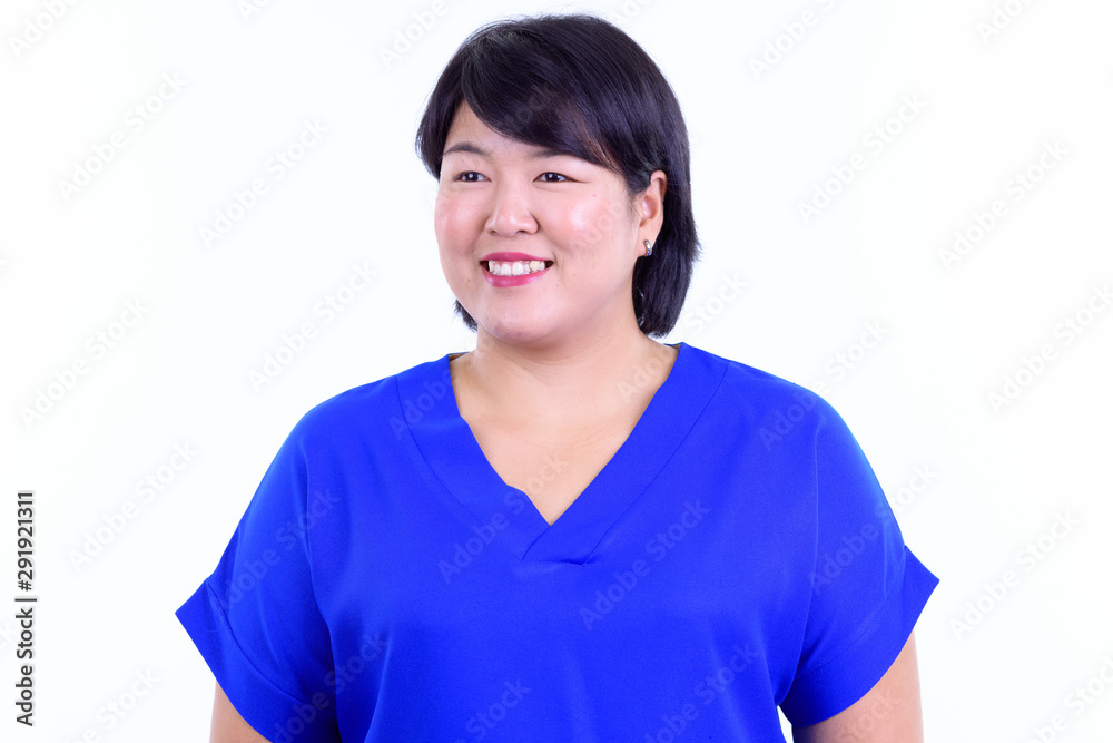 Face of happy overweight Asian businesswoman thinking Face of happy overweight Asian businesswoman thinking