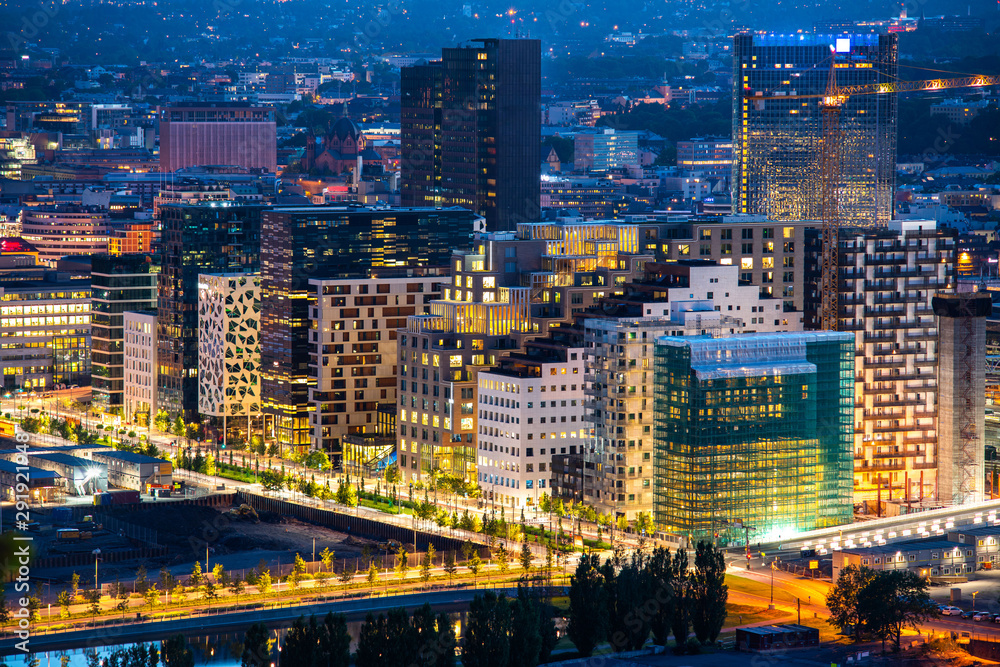 Night view of illuminated street in the Oslo business center. Modern architecture in Norway