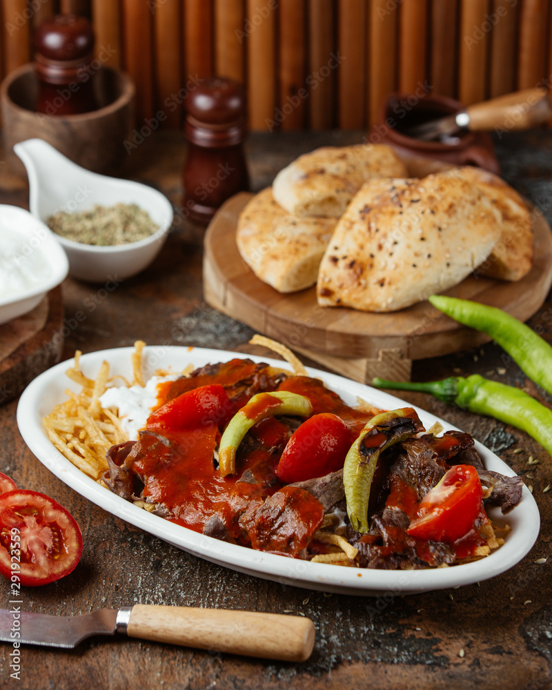 Fried meat slices in tomato paste with vegetables Fried meat slices in tomato paste with vegetables