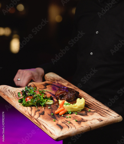 Fototapeta Naklejka Na Ścianę i Meble -  Fried meat with vegetables on wooden board