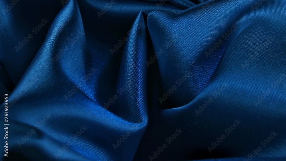 Draped dark biue satin fabric, background Draped dark biue satin fabric, background