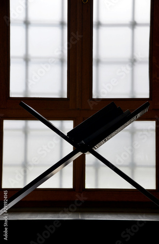 silhouette in the window of a mosque