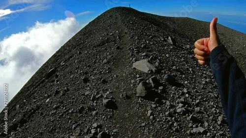 Climbing the crater of Semeru. Backpacker walking around Semeru crater on the top of mountain. POV shot veiw on breathtaking panorama from a height of 3,600 meters