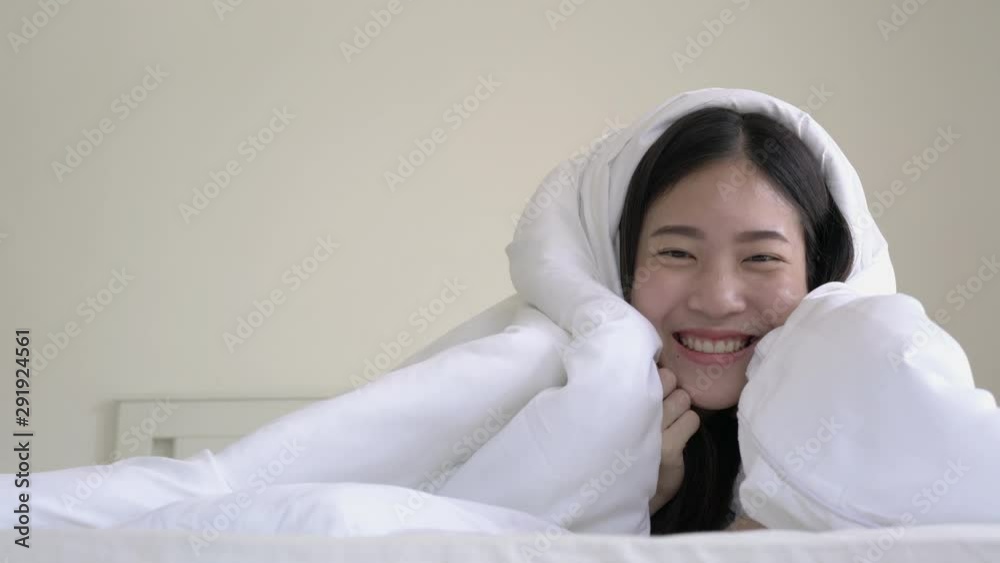 Asian young girl waking up and happy emotion in the morning at bed room. Concept of happy home, family, education and health. Asian young girl waking up and happy emotion in the morning at bed room. Concept of happy home, family, education and health.