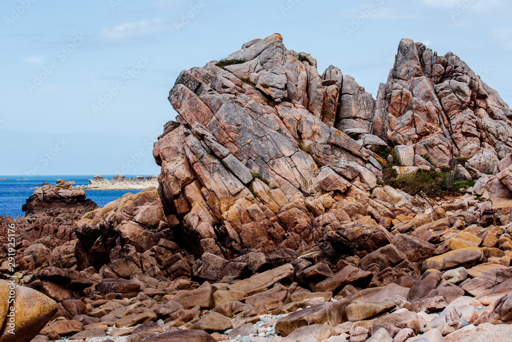Bretonic Coast and Beach with Granite Rocks at the Cote de Granit Rose - Pink Granite Coast
