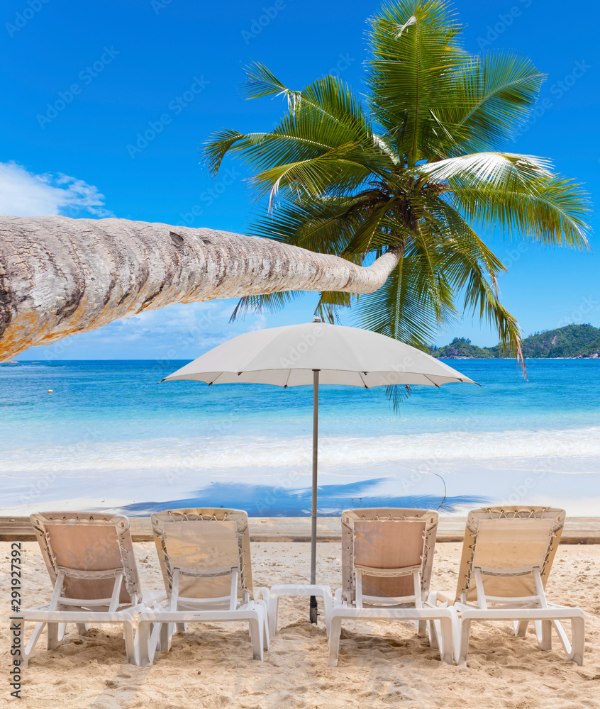 beach with chairs and umbrellas, Seychelles Islands 