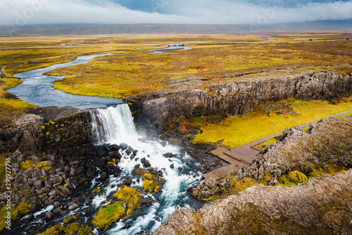 Aerial view autumn landscape in Iceland  rocky canyon with waterfall.