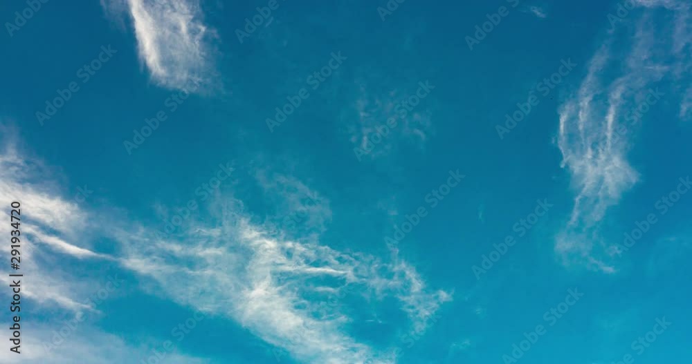 Floating clouds in blue sky, time lapse. Blue sky background