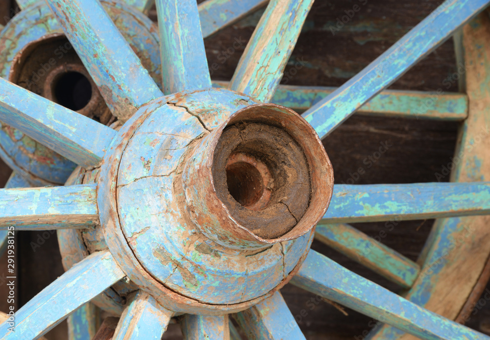 old horse carriage wheel on background