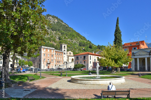 A public fountain in the square of an old Italian village