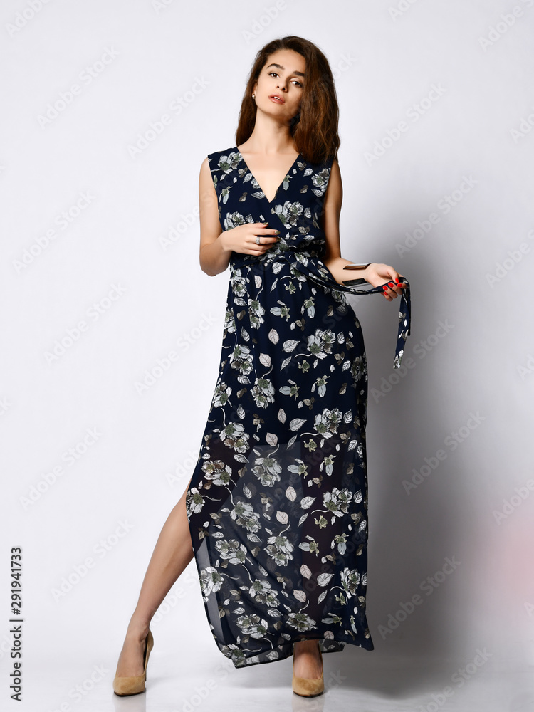 Woman in Long Floral Dress in Fashion Store - Portrait of girl in a clothes shop in a maxi summer dress