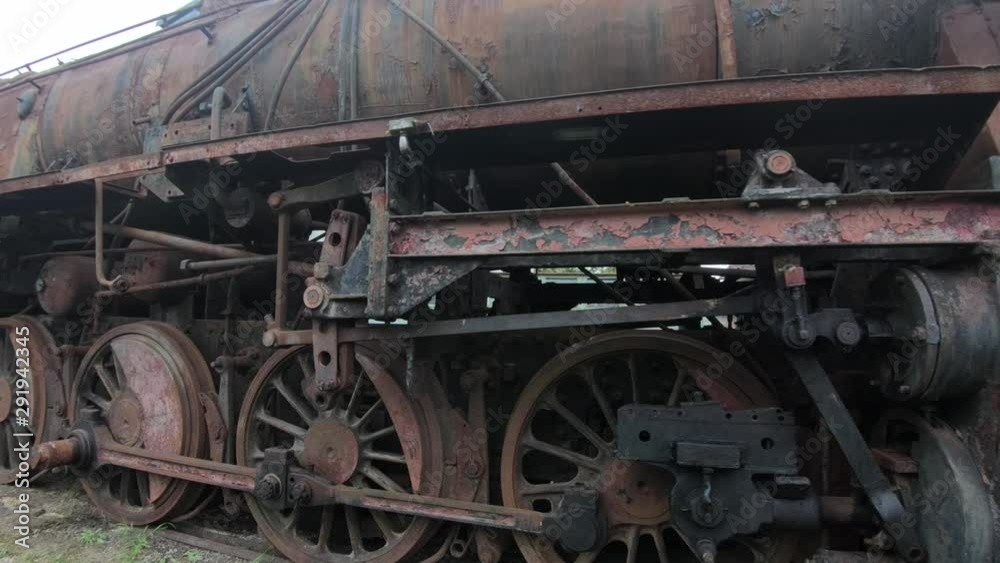 4K forward closeup right pan abandoned rusted locomotive steel wagons 4K forward closeup right pan abandoned rusted locomotive steel wagons