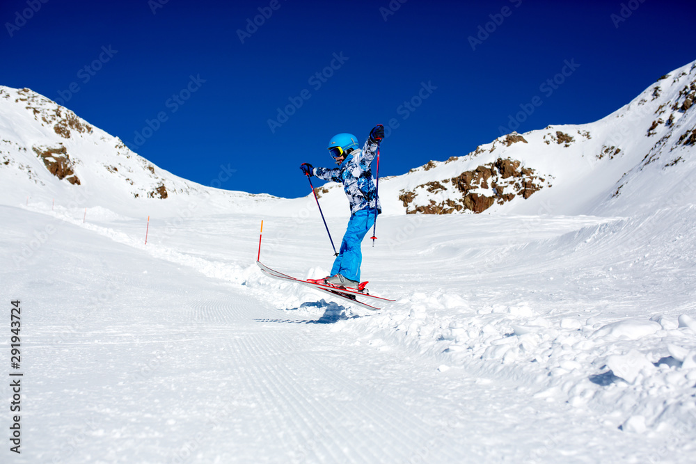 Happy people, children and adults, skiing on a sunny day in Tyrol mountains Happy people, children and adults, skiing on a sunny day in Tyrol mountains