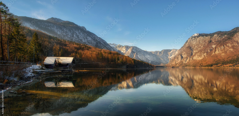Autumn reflections on lake Bohinj, Julian Alps, the largest permanent lake in Slovenia.