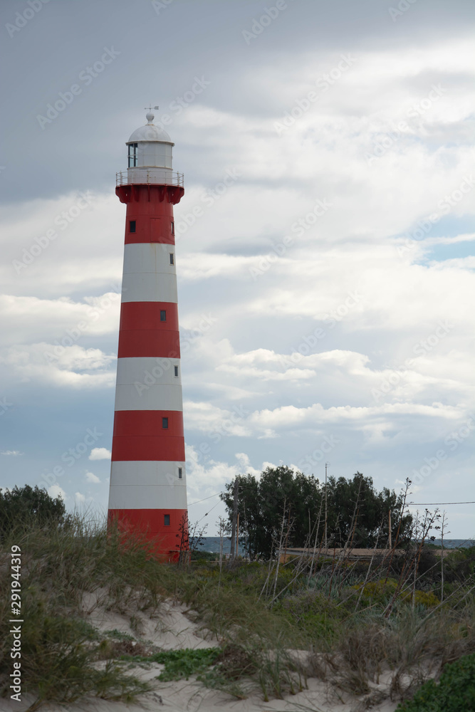 Red and white light house