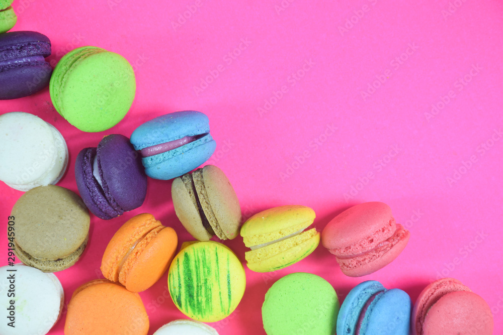 French colorful macarons on pink background French colorful macarons on pink background
