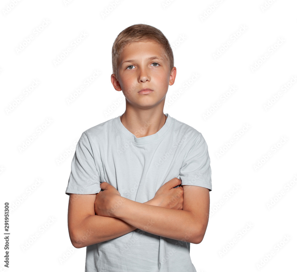 Close-up portrait of a blonde teenage boy in a white t-shirt posing isolated on white studio background. Concept of sincere emotions.
